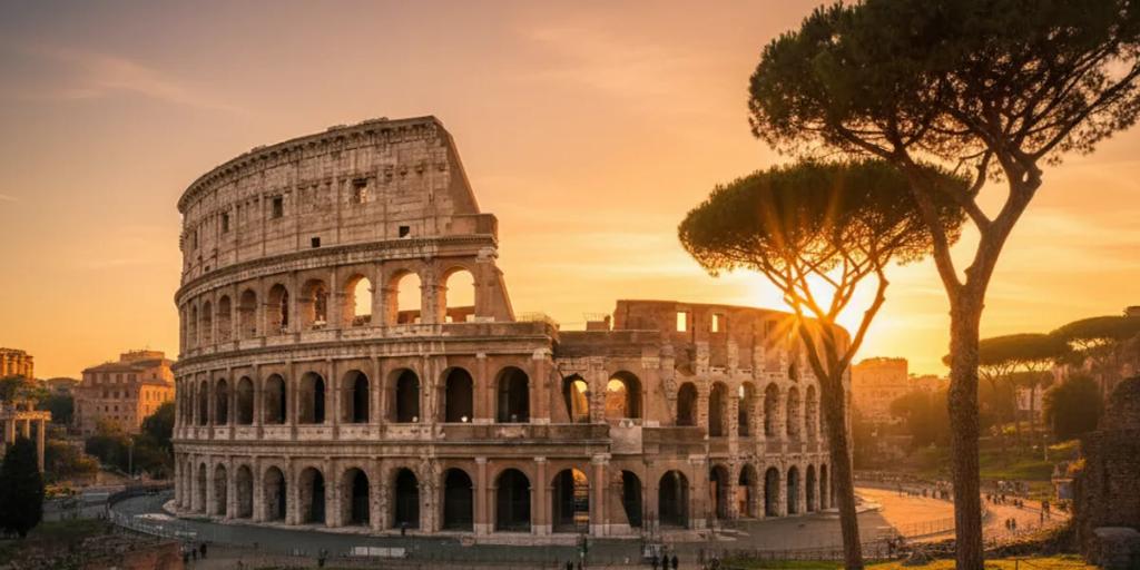 Los tejados de Roma a la hora dorada con el Coliseo elevándose sobre el skyline de terracota